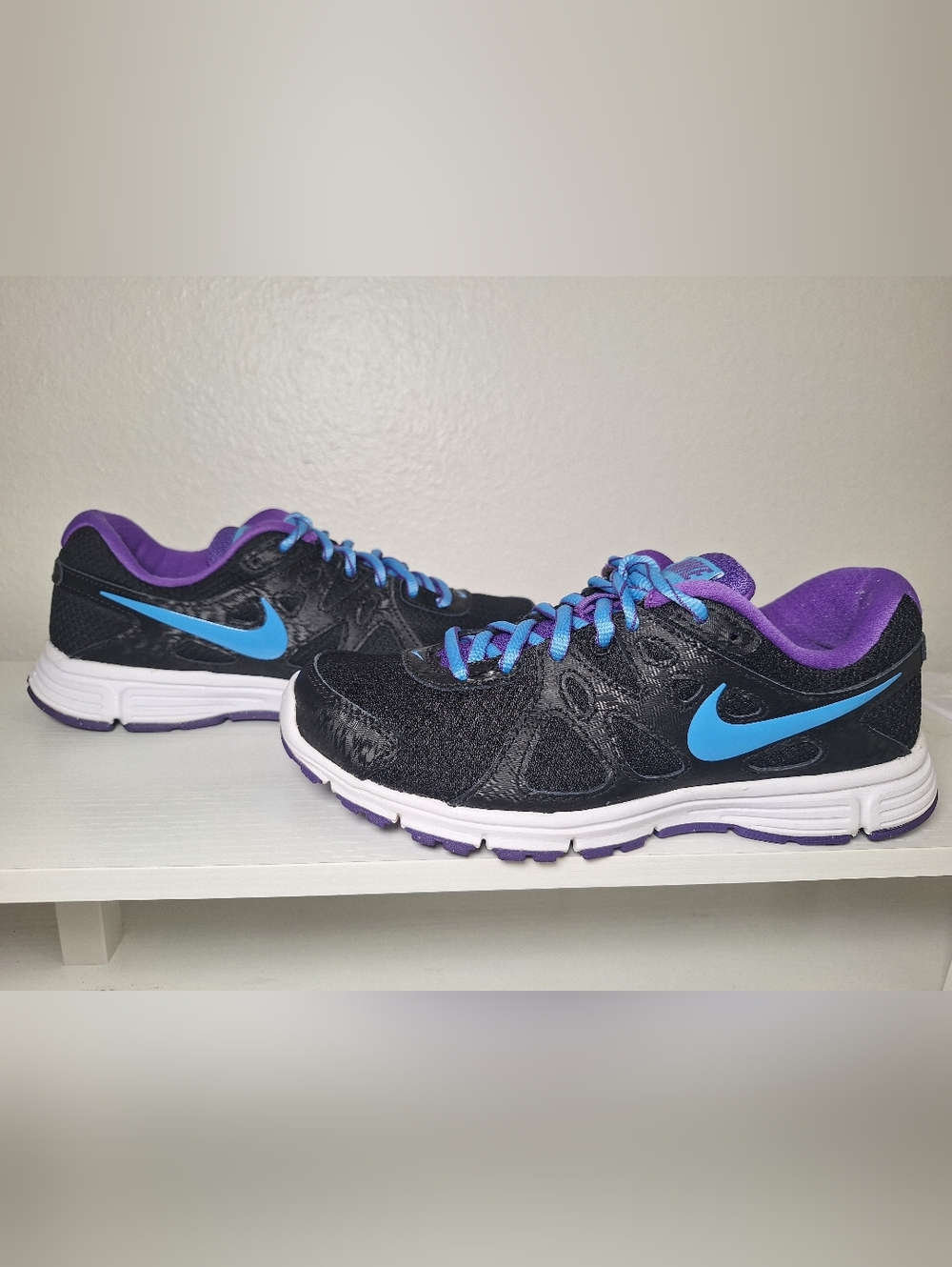 Nike Black Running Shoes with Blue Swoosh and Purple Accents